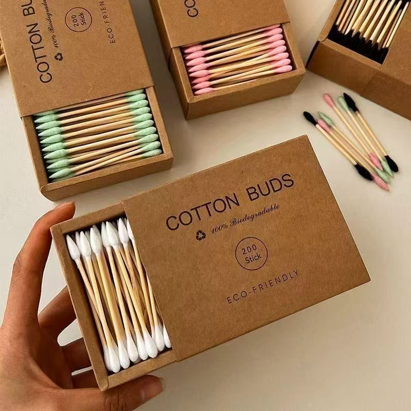 Eco-friendly bamboo and wood ~ 200-pack of disposable double-ended cotton swabs in a kraft paper box for cleansing and makeup removal.