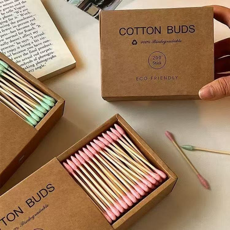 Eco-friendly bamboo and wood ~ 200-pack of disposable double-ended cotton swabs in a kraft paper box for cleansing and makeup removal.