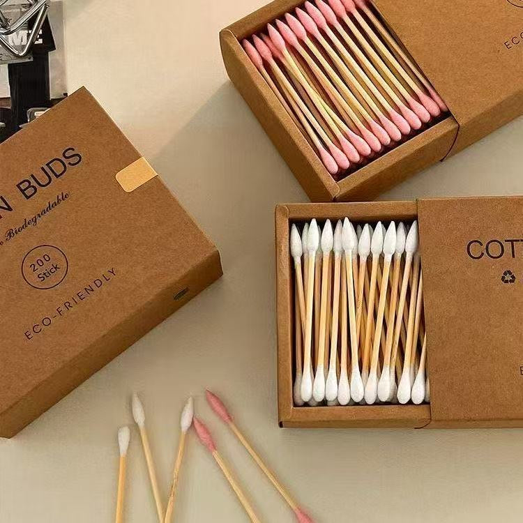 Eco-friendly bamboo and wood ~ 200-pack of disposable double-ended cotton swabs in a kraft paper box for cleansing and makeup removal.