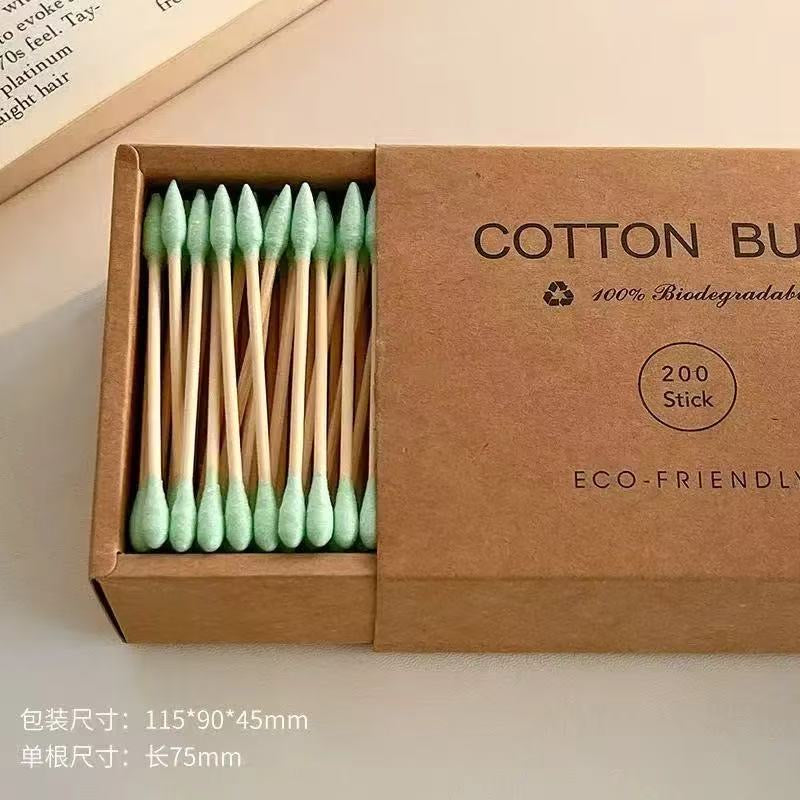 Eco-friendly bamboo and wood ~ 200-pack of disposable double-ended cotton swabs in a kraft paper box for cleansing and makeup removal.