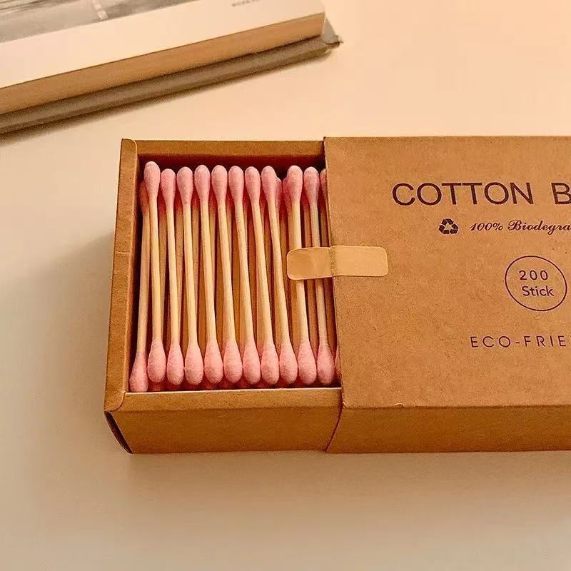 Eco-friendly bamboo and wood ~ 200-pack of disposable double-ended cotton swabs in a kraft paper box for cleansing and makeup removal.