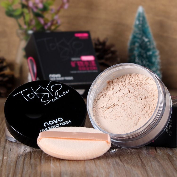 NOVO loose powder — waterproof, sweatproof, long-lasting setting powder with oil control. Helps prevent makeup from fading or caking, brightens the skin tone, and is suitable for students.